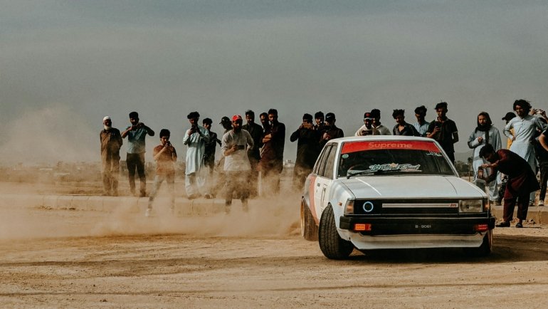 Vintage dirt track stock car racing capturing the spirit of Travelers Rest Speedway SC, a historic grassroots race track in South Carolina during its mid-20th century glory days.