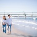 Happy pregnant couple enjoying a serene babymoon vacation, highlighting the peace of mind from comprehensive travel insurance for pregnant women and safe pregnancy travel.