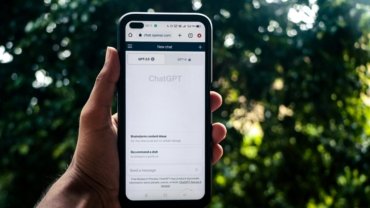 Mobile phone screen showing AI chatbot for Snap Travel hotel booking, highlighting exclusive travel deals and convenient savings now integrated with Super.com.