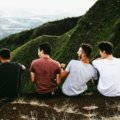 A diverse group of happy friends exploring a scenic destination, illustrating the joy of finding perfect travel mates for an unforgettable group adventure.