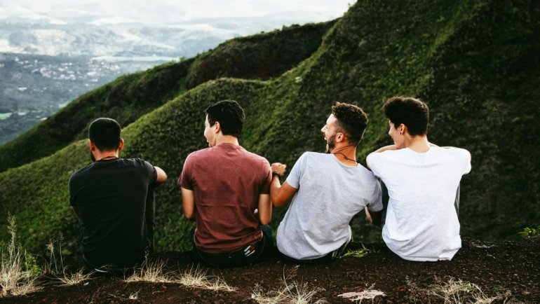 A diverse group of happy friends exploring a scenic destination, illustrating the joy of finding perfect travel mates for an unforgettable group adventure.