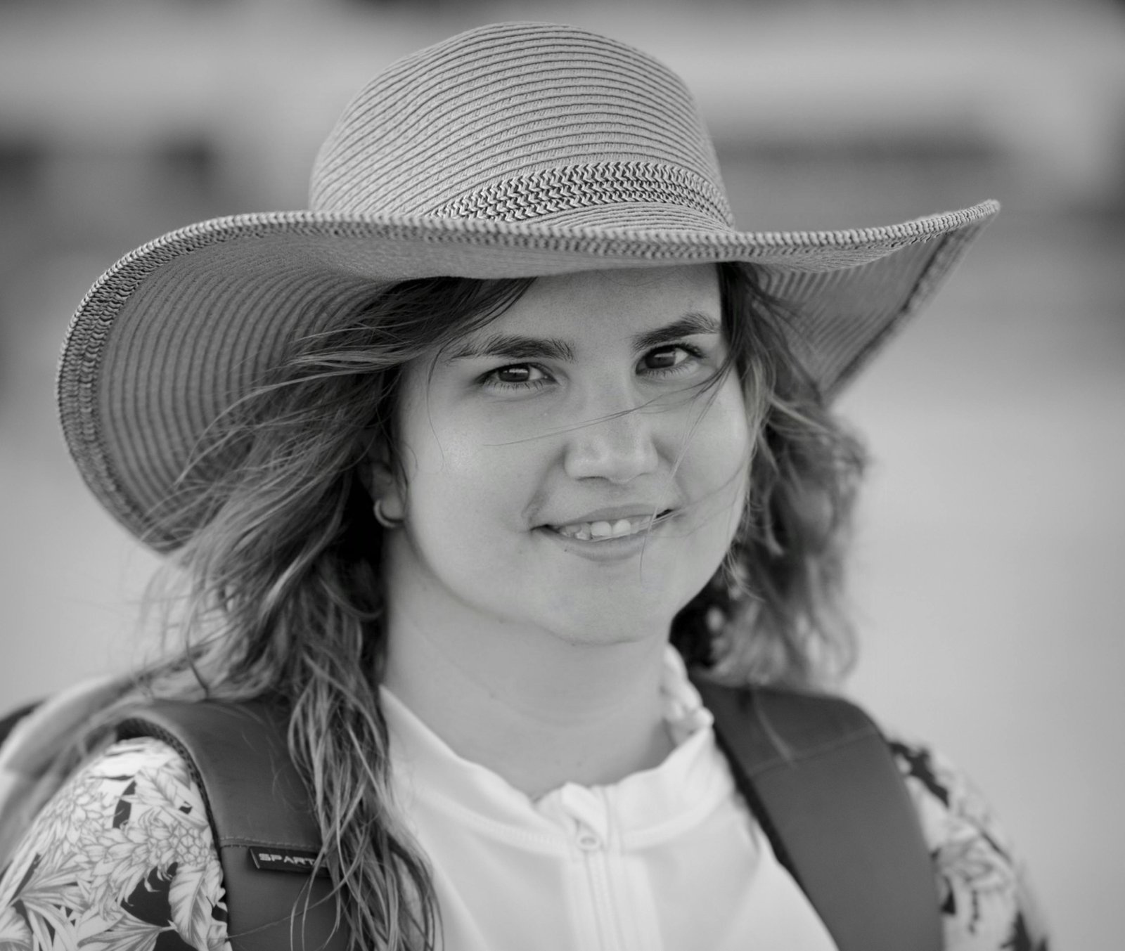 Happy travel nurse enjoying a Florida beach, highlighting rewarding travel RN jobs in Florida and the state's ideal work-life balance.