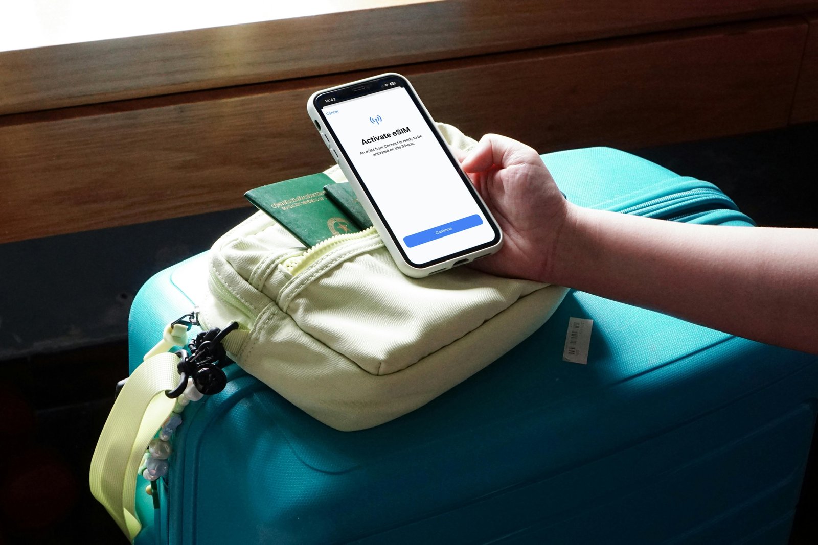 Curated flat lay of essential travel gifts for globetrotters, featuring a passport, map, noise-canceling headphones, portable charger, packing cubes, and a camera, symbolizing seamless and inspiring adventures.