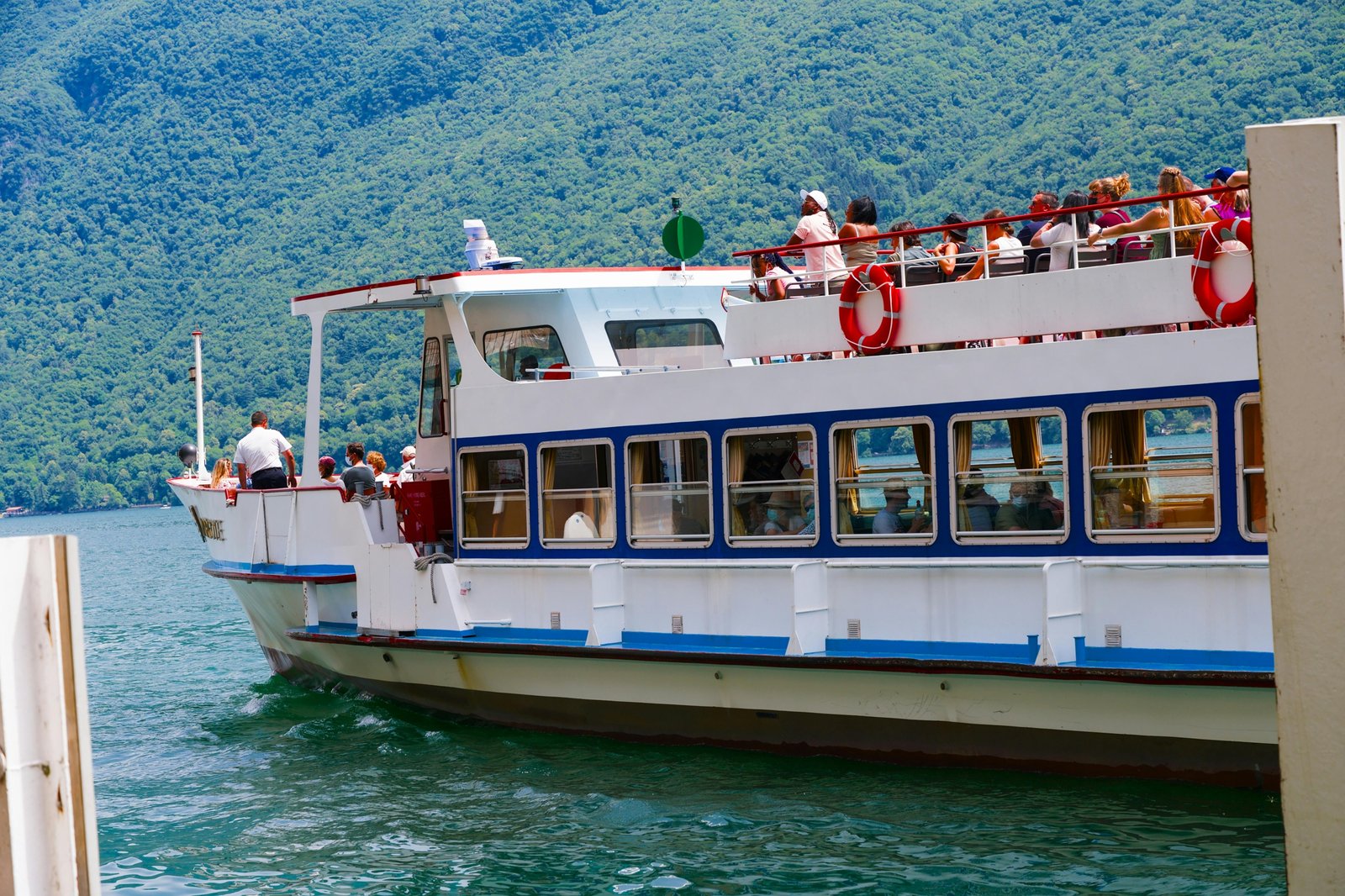 Indy Boat Sport and Travel Show, large exhibition hall with visitors exploring various boats, fishing equipment, and travel destinations, reflecting the excitement for outdoor adventure and 2025 travel planning.