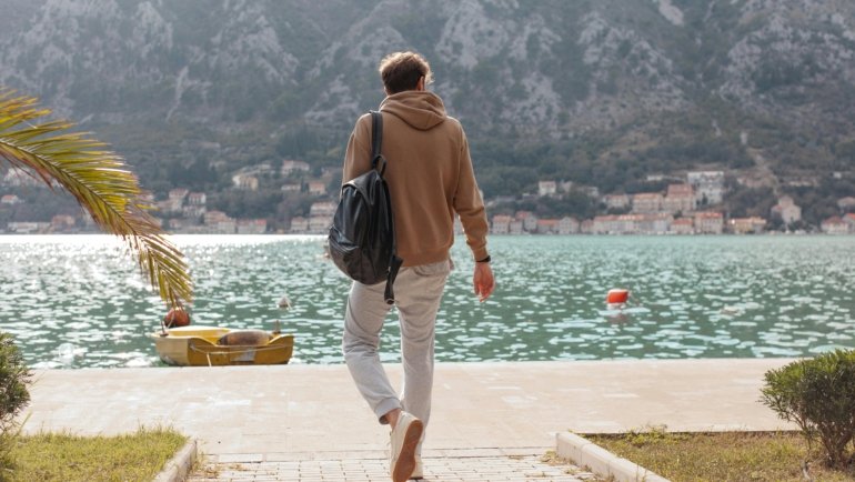 Man wearing versatile men's travel pants, ideal for urban exploration and outdoor adventure, offering comfort, durability, and style.