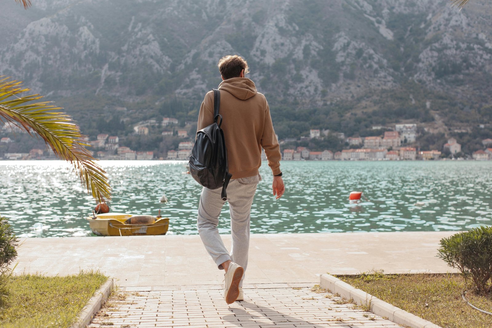 Man wearing versatile men's travel pants, ideal for urban exploration and outdoor adventure, offering comfort, durability, and style.