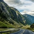 Dramatic Norwegian fjord and towering mountain landscape, showcasing the breathtaking scenery for an unforgettable travel adventure.