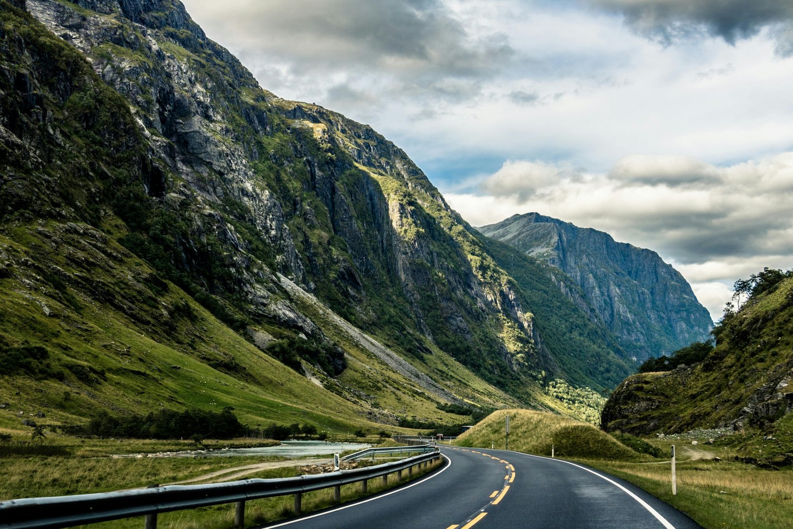 Dramatic Norwegian fjord and towering mountain landscape, showcasing the breathtaking scenery for an unforgettable travel adventure.