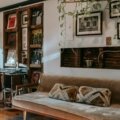 Vintage steamer travel trunk used as a coffee table in a stylish living room, showcasing its antique charm, leather details, and modern home decor versatility.