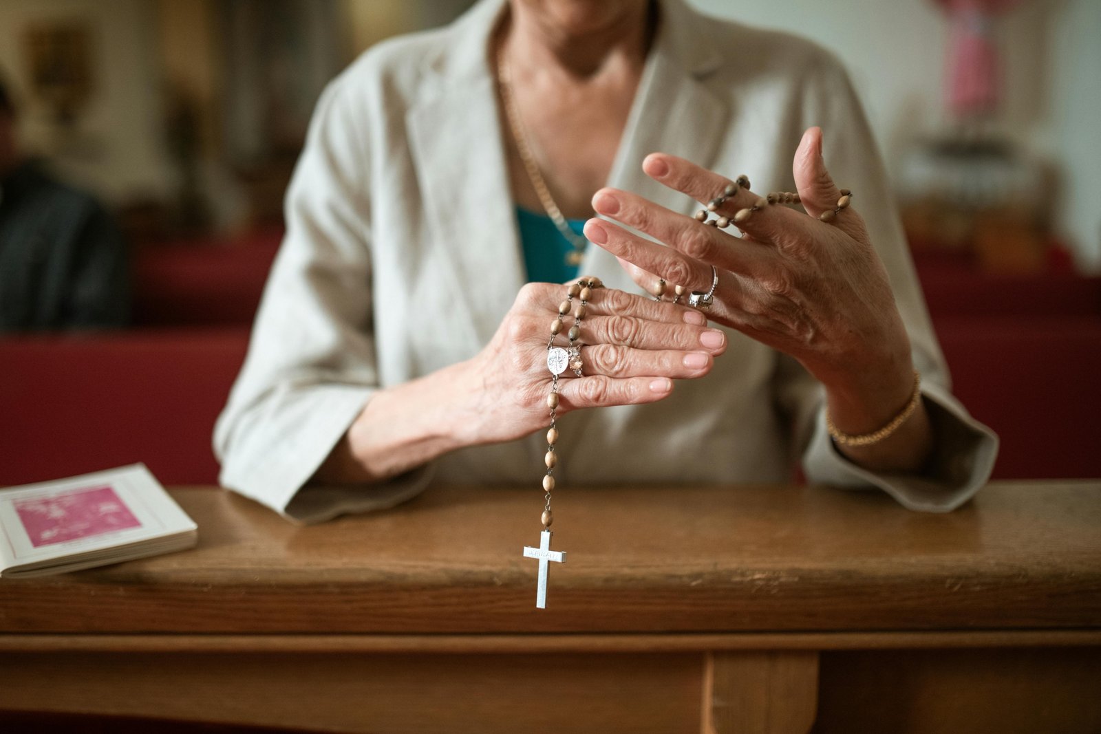 Hands clasped in prayer for traveling, symbolizing peace, protection, and guidance for a safe and positive journey.