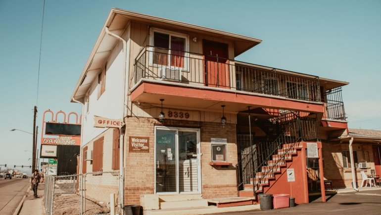 Travelers Inn Alexandria MN exterior, a budget-friendly and welcoming motel providing comfortable lodging with essential amenities for a pleasant stay in Minnesota's lake country, ideal for exploring local attractions.