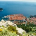 Panoramic view of a historic Croatian city along the Dalmatian Coast, featuring ancient architecture nestled against the vibrant blue Adriatic Sea, ideal for a 7-day travel itinerary.