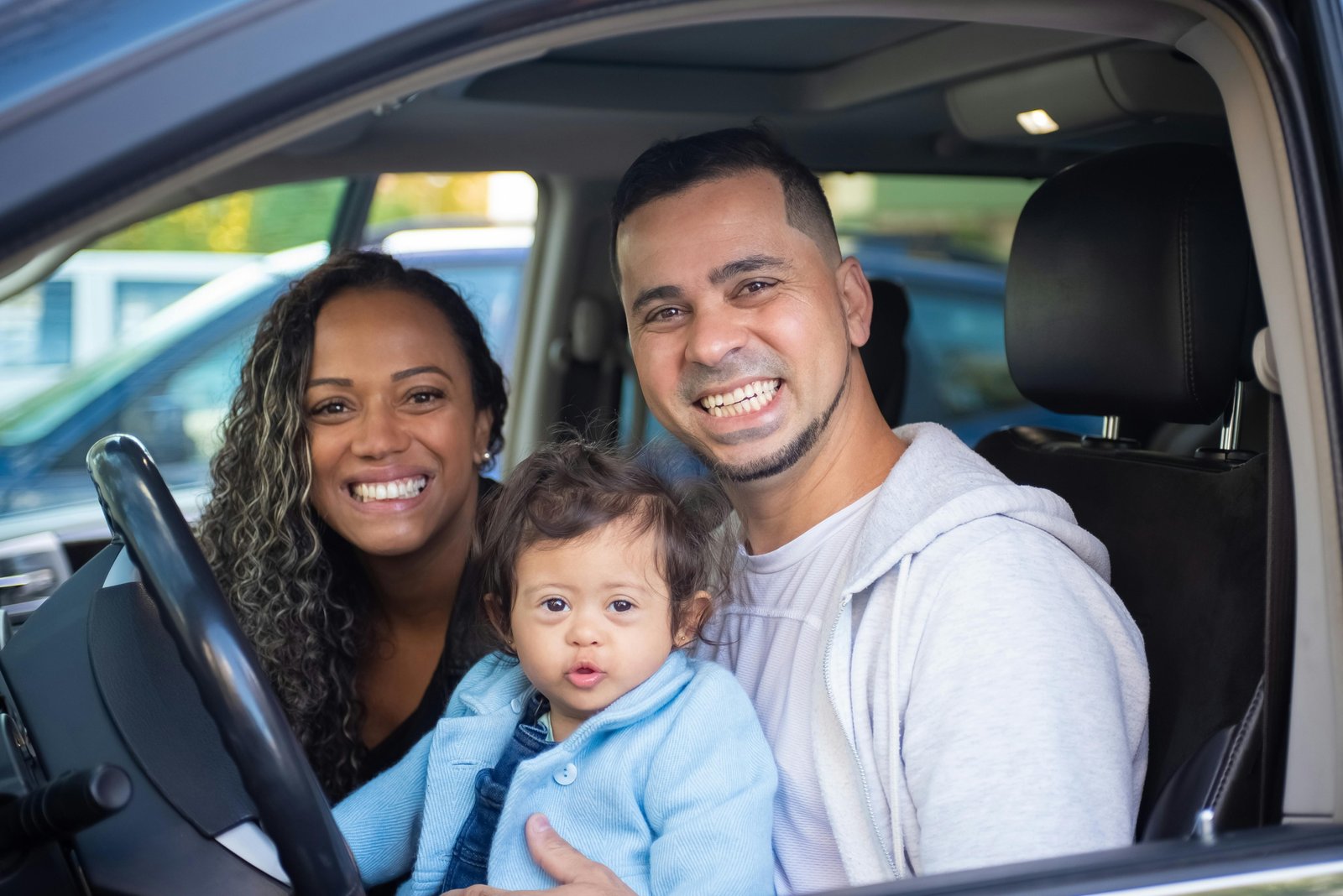 Modern urban parents effortlessly using the Nuna Pipa Urbn travel system, showcasing its lightweight design and convenient baseless car seat for safe, on-the-go city life with a newborn.