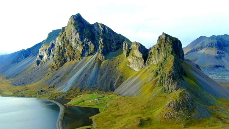 Iceland's breathtaking diverse landscape, featuring elements that hint at summer road trips, winter ice caves, and the Northern Lights, helping visitors decide the best time to travel.