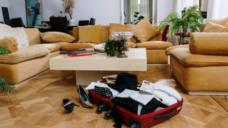 Fully furnished modern apartment living room, ready for a travel nurse, symbolizing profitable and convenient short-term rental housing.