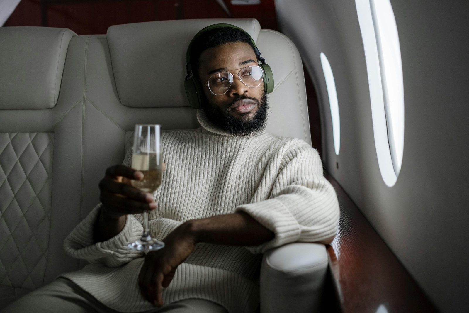 Soft, portable travel blanket providing warmth and comfort to a person relaxing on an airplane seat, emphasizing its benefits for long flights and travel.