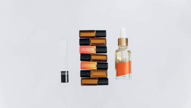 A flat lay showcasing various TSA-approved travel body wash options, including solid bars, liquid gels, and concentrated formulas, alongside other compact toiletries for a perfectly organized carry-on.