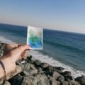 A confident traveler exploring a global destination, representing Blue Cross Blue Shield travel insurance and peace of mind for international medical coverage through BlueCard Worldwide.