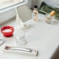 A stylish and organized men's travel kit (dopp kit) open, showcasing travel-sized grooming essentials like toothpaste, razor, and skincare products, ideal for efficient packing and fresh travel.