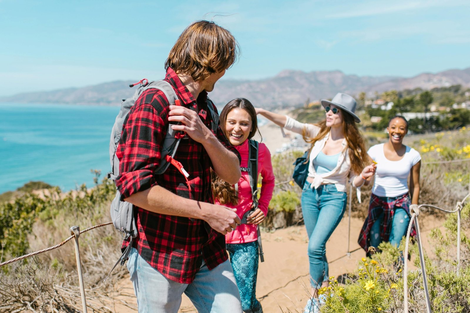 Glavs Travel: Happy diverse travelers on a personalized, unforgettable journey to a scenic global destination.