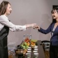 Portable coffee catering box with cups, creamers, and stirrers for office meetings, group events, and convenient coffee service.