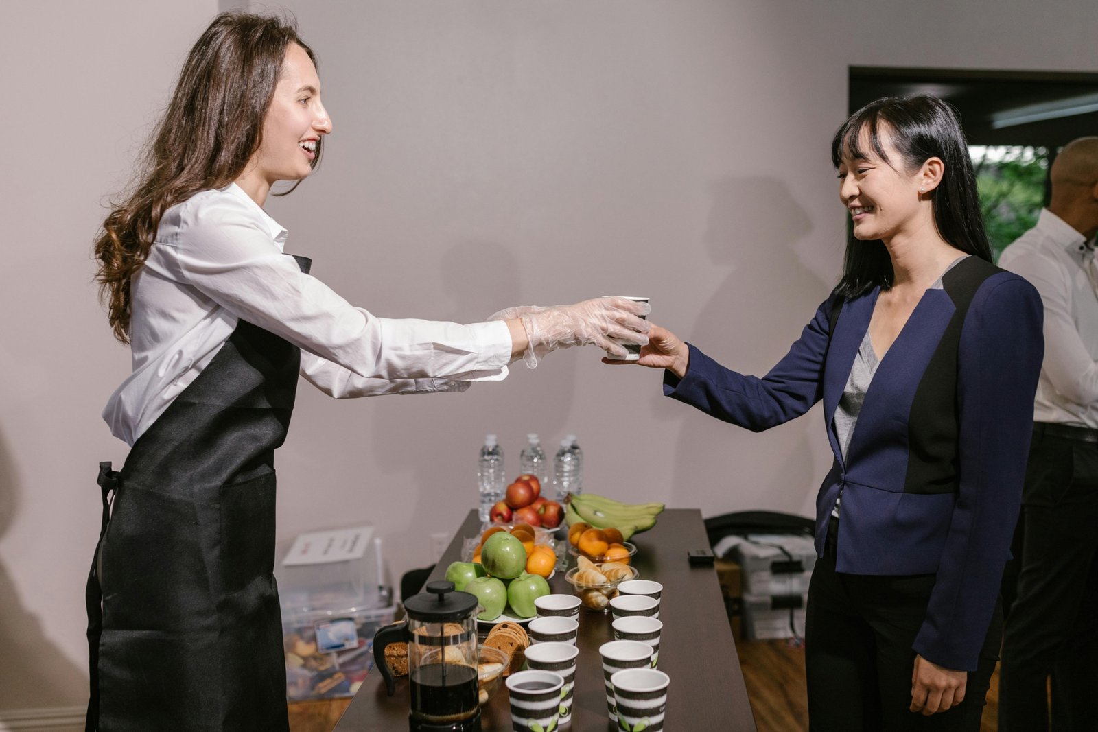 Portable coffee catering box with cups, creamers, and stirrers for office meetings, group events, and convenient coffee service.