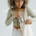 Portable travel warmer bottle keeping coffee hot for a commuter and baby milk warm for a parent on the go.