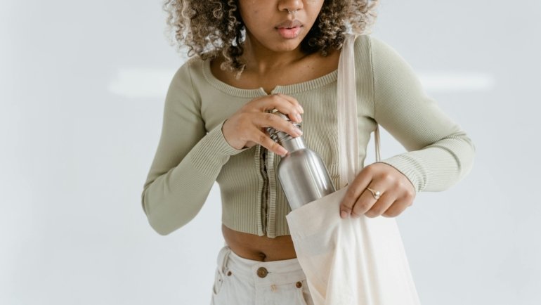 Portable travel warmer bottle keeping coffee hot for a commuter and baby milk warm for a parent on the go.