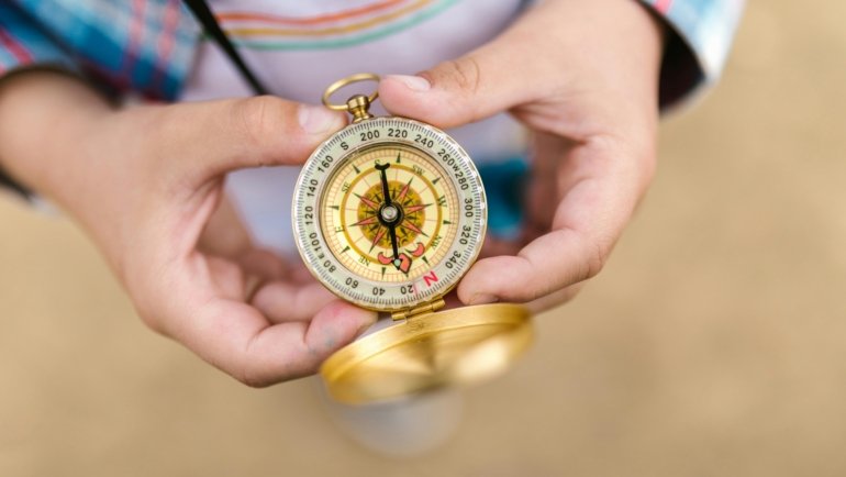 Hands clasped in prayer for traveling mercies, symbolizing a safe, peaceful, and divinely protected journey, offering comfort before departure.