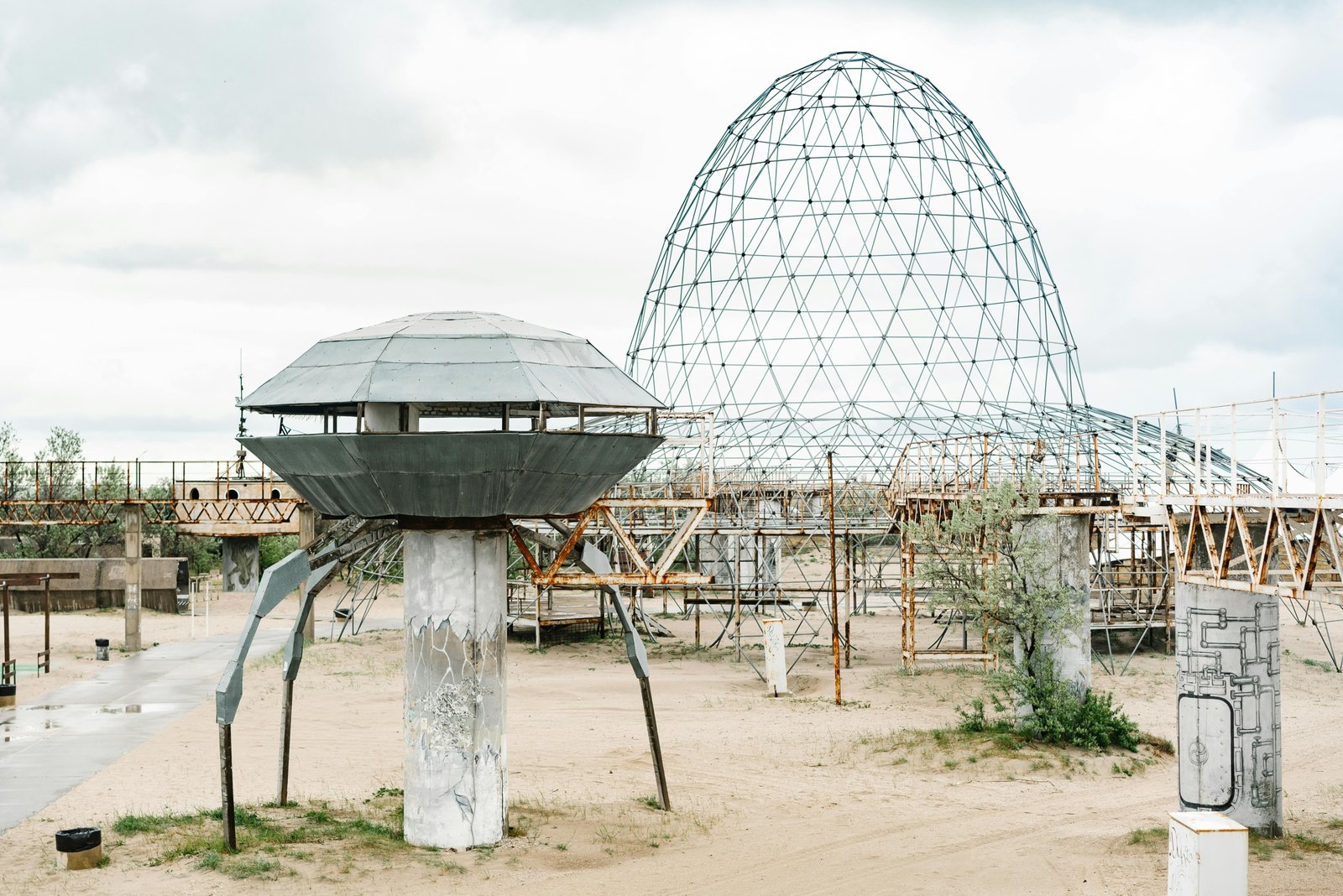 The Space Age Travel Center in Gila Bend, Arizona, an iconic retro-futuristic roadside attraction with its UFO-shaped Googie architecture and classic diner, set against a desert landscape.