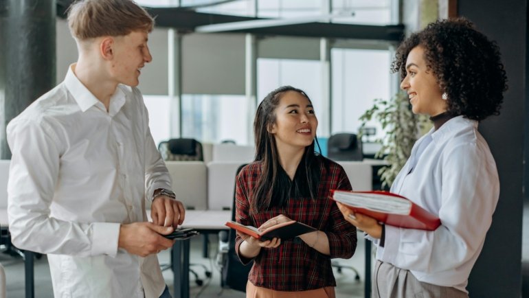 Diverse employees smiling, representing Love's Travel Stop careers, job opportunities, and professional growth within a supportive team environment.