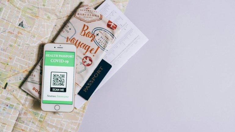 Digital passport displayed on an Android smartphone held by a traveler at an airport, representing secure and efficient modern travel ID.