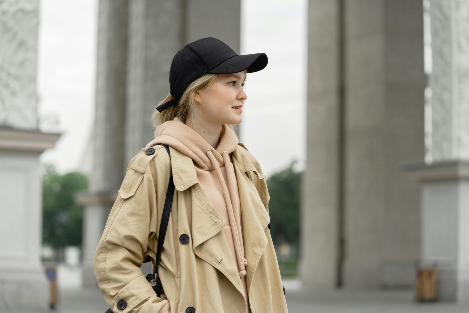 Stylish woman wearing a versatile and packable travel jacket for ladies, ready for city exploration and outdoor adventures.
