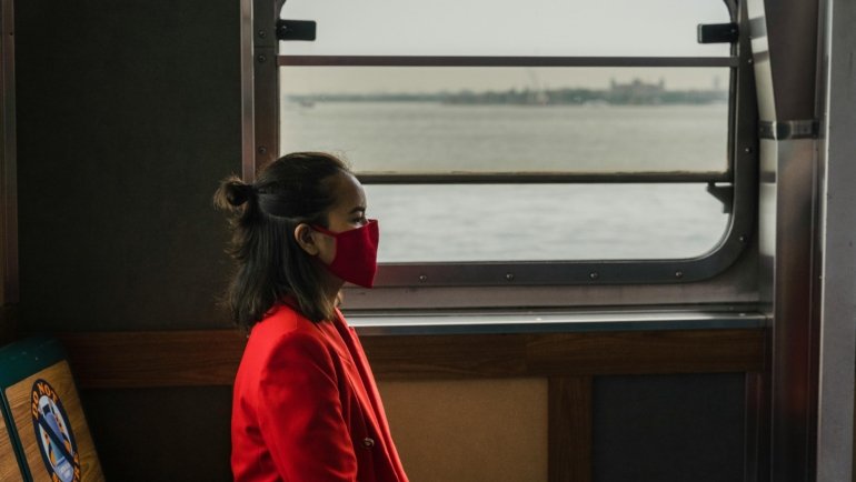 Hands clasped in a mindful, peaceful gesture, symbolizing a prayer for safe traveling and spiritual protection on any journey.