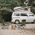 Travel Lite lightweight RV, a compact travel trailer or truck camper, parked in a scenic natural landscape, representing accessible and easy RV camping.
