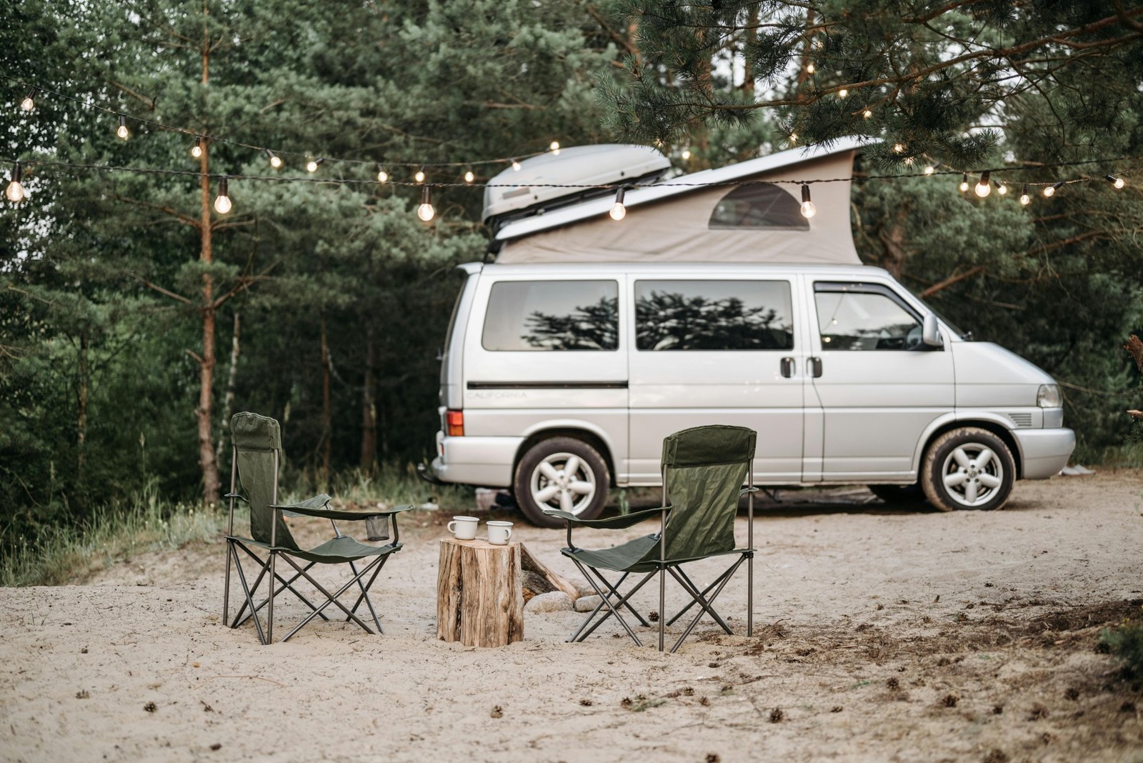 Travel Lite lightweight RV, a compact travel trailer or truck camper, parked in a scenic natural landscape, representing accessible and easy RV camping.