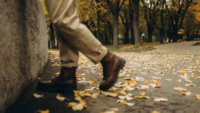 Traveler confidently walking in comfortable, stylish, and versatile travel pants, suitable for airport comfort, city exploration, and adventure travel.