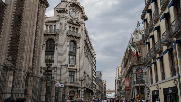 Vibrant historic center of Mexico City with colorful colonial buildings, lively street activity, and iconic architecture, reflecting the rich culture, art, and history of this dynamic travel destination.