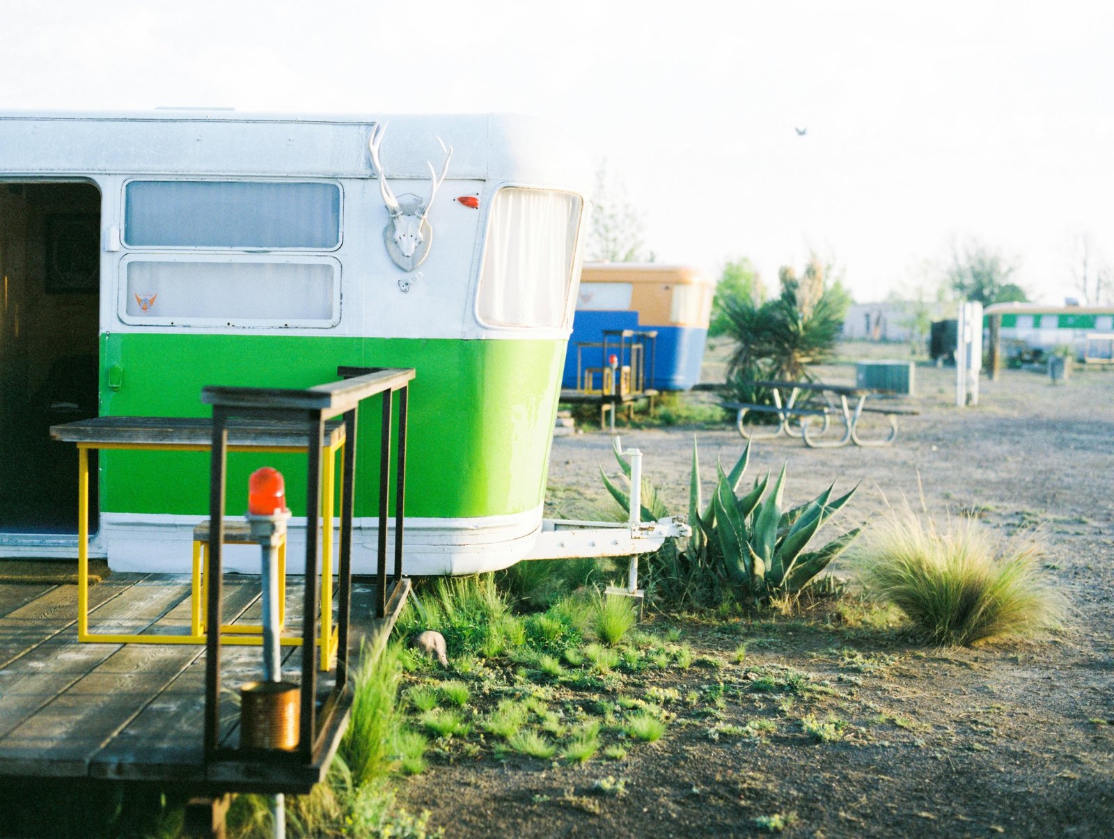 Vibrant retro style Riverside travel trailer in a picturesque outdoor camping setting, combining vintage design with modern comfort for adventure.