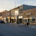 A picturesque main street in a charming small town, featuring local boutiques, cafes, and a relaxed atmosphere, perfect for authentic main street travel experiences.