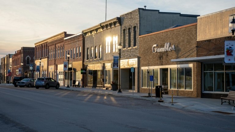 A picturesque main street in a charming small town, featuring local boutiques, cafes, and a relaxed atmosphere, perfect for authentic main street travel experiences.