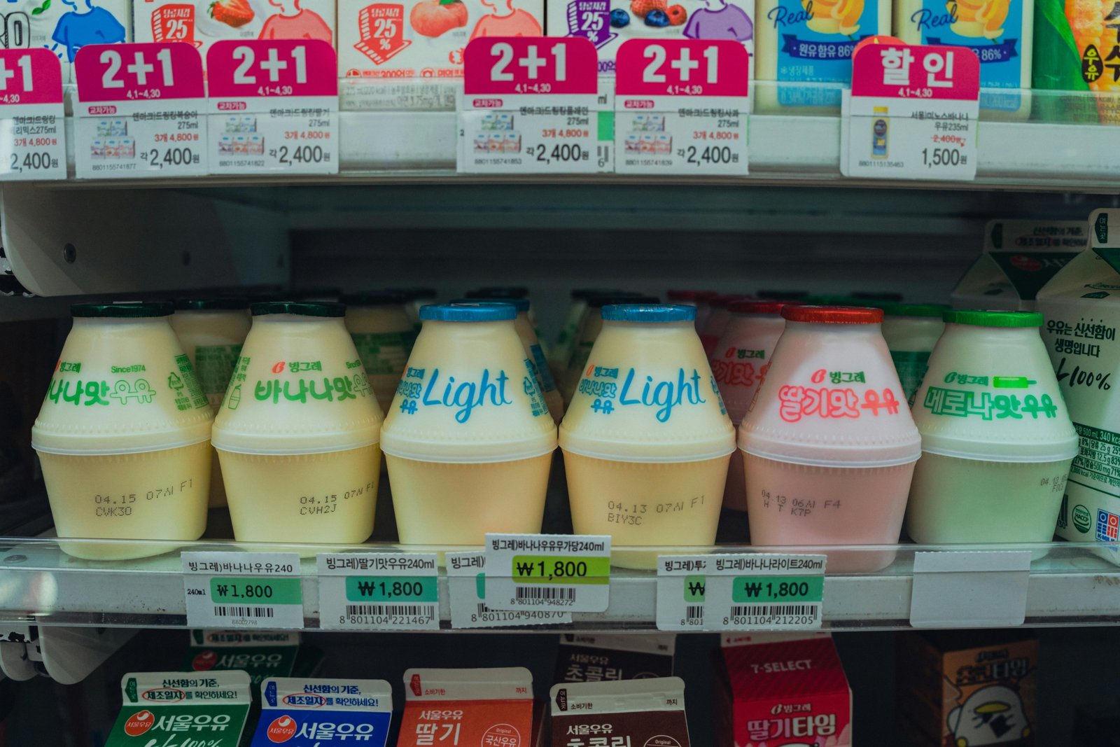 Open travel trailer fridge (RV fridge) interior, showcasing fresh food and cold drinks for enjoyable camping and travel.