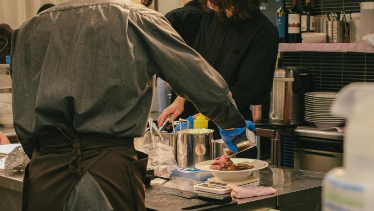 Houston's diverse and world-class culinary scene, with a gourmet dish against a city backdrop, highlighting its Michelin-worthy restaurants and attractions in an unofficial guide.
