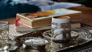 Vibrant Assouline luxury travel books displayed on a stylish coffee table in a sophisticated living room, inspiring wanderlust and elegant home decor.