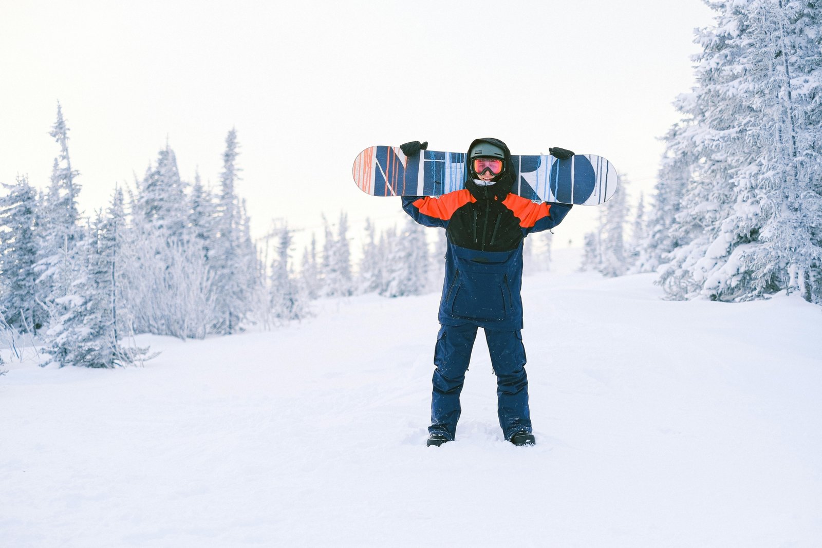 A person confidently wheels a durable ski or snowboard travel bag through an airport terminal, showcasing convenient and protected transport for winter sports gear to the mountains.