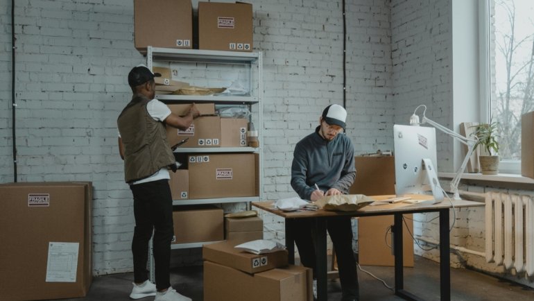 A bustling One 9 Travel Center at dusk, with multiple semi-trucks parked and fueling, highlighting essential amenities and a reliable stop for professional drivers.