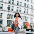 Stylish female influencer in New York City, representing beauty fashion lifestyle travel blogging and successful content creation in a dynamic urban setting.