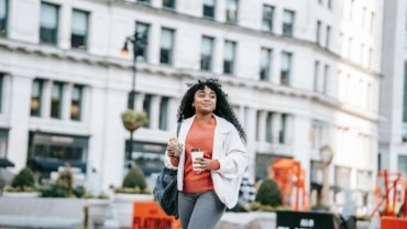 Stylish female influencer in New York City, representing beauty fashion lifestyle travel blogging and successful content creation in a dynamic urban setting.