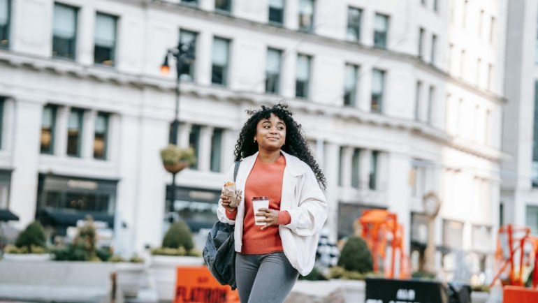 Stylish female influencer in New York City, representing beauty fashion lifestyle travel blogging and successful content creation in a dynamic urban setting.
