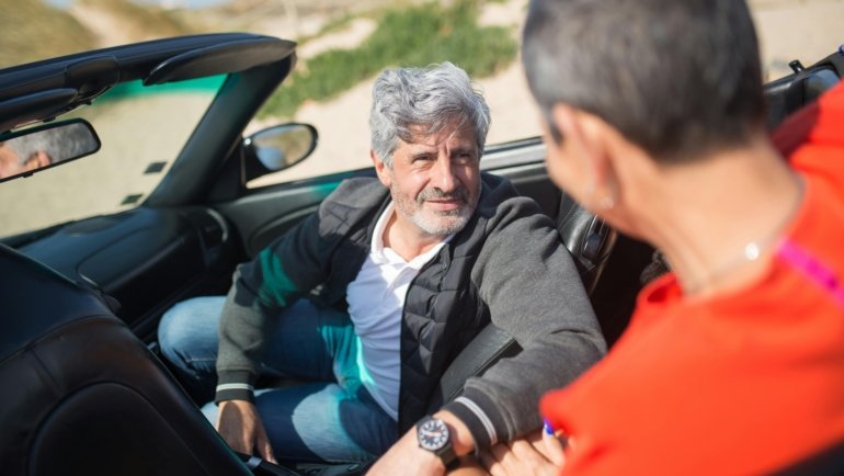 Happy senior couple enjoying accessible SR travel, exploring a scenic destination with comfort and ease, promoting enriching travel experiences for older adults.